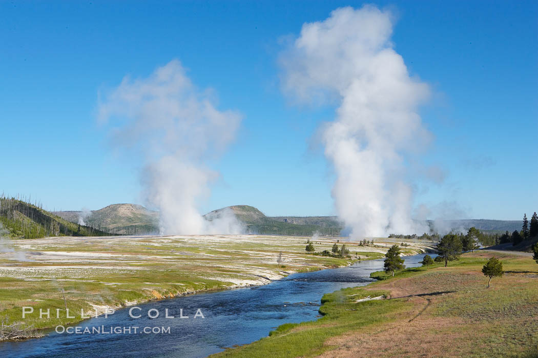 Steam rises above the Midway Geyser Basin, largely from Grand Prismatic Spring and Excelsior Geyser. The Firehole River flows by. Yellowstone National Park, Wyoming, USA, natural history stock photograph, photo id 13605