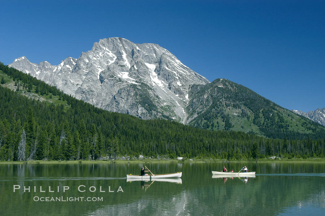 Canoers paddle across String Lake below Mount Moran. Grand Teton National Park, Wyoming, USA, natural history stock photograph, photo id 07404