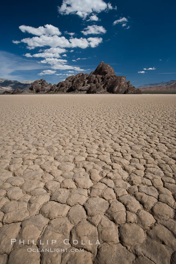 The Grandstand, standing above dried mud flats, on the Racetrack Playa in Death Valley. Death Valley National Park, California, USA, natural history stock photograph, photo id 25311