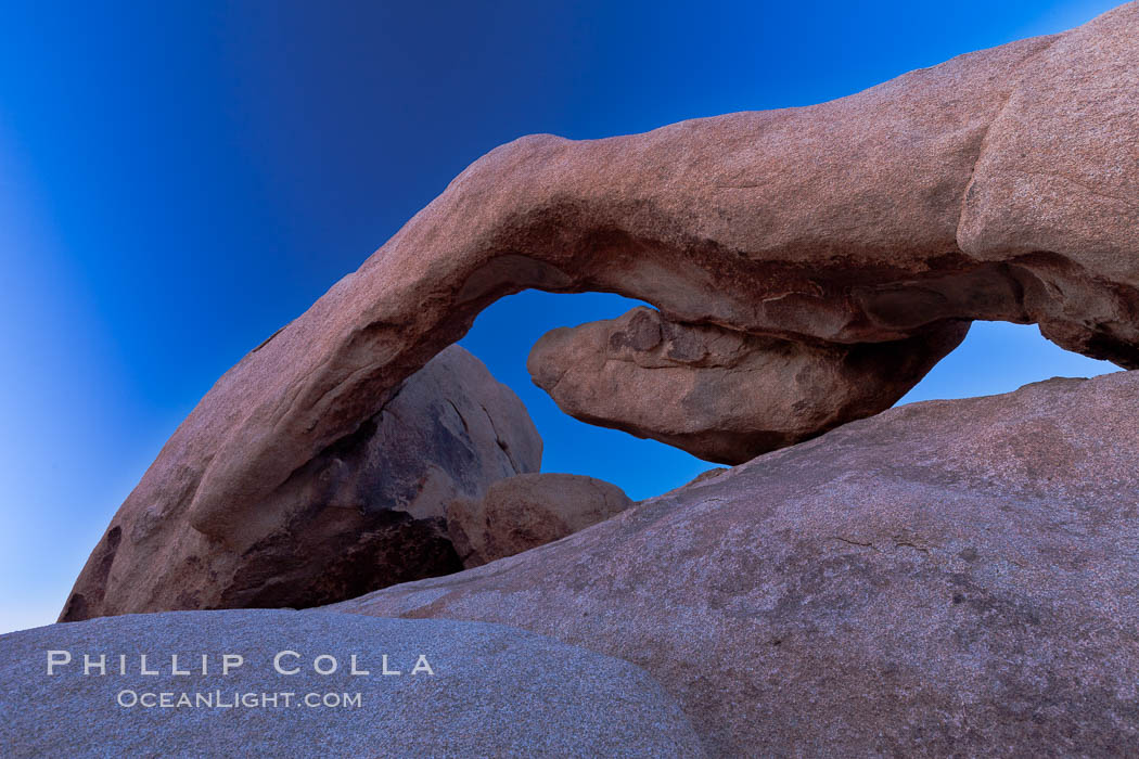 Arch Rock, an ancient granite natural stone arch at Joshua Tree National park, at sunset. Joshua Tree National Park, California, USA, natural history stock photograph, photo id 26802