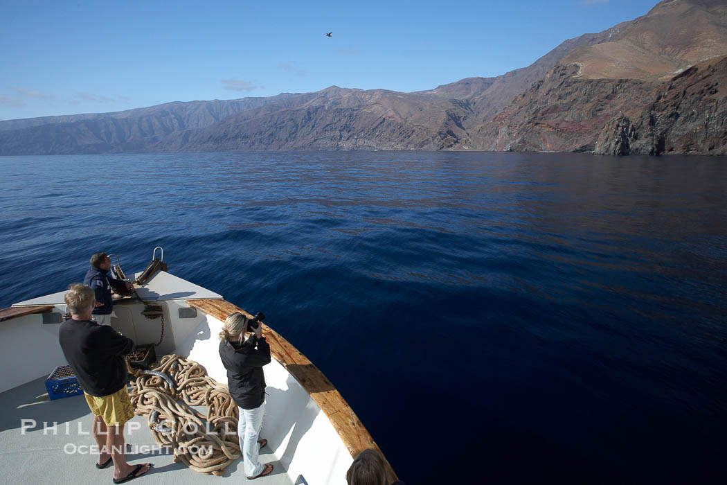 Guadalupe Island, cliffs rising above north end of the island over glassy seas., natural history stock photograph, photo id 21398