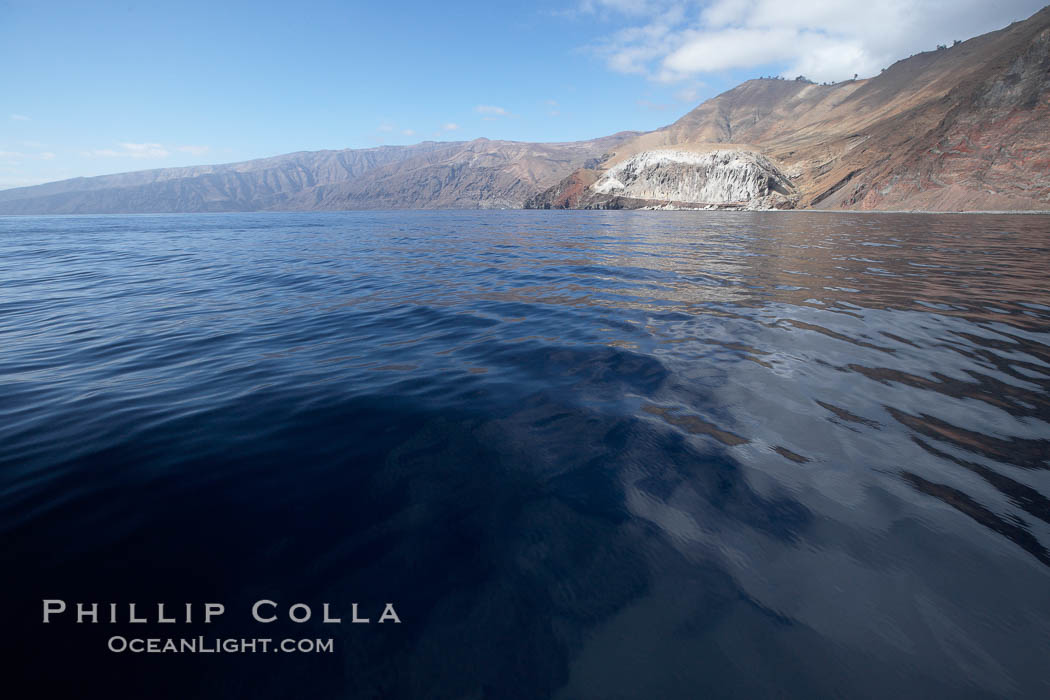 Guadalupe Island, cliffs rising above north end of the island over glassy seas. Guadalupe Island (Isla Guadalupe), Baja California, Mexico, natural history stock photograph, photo id 21396