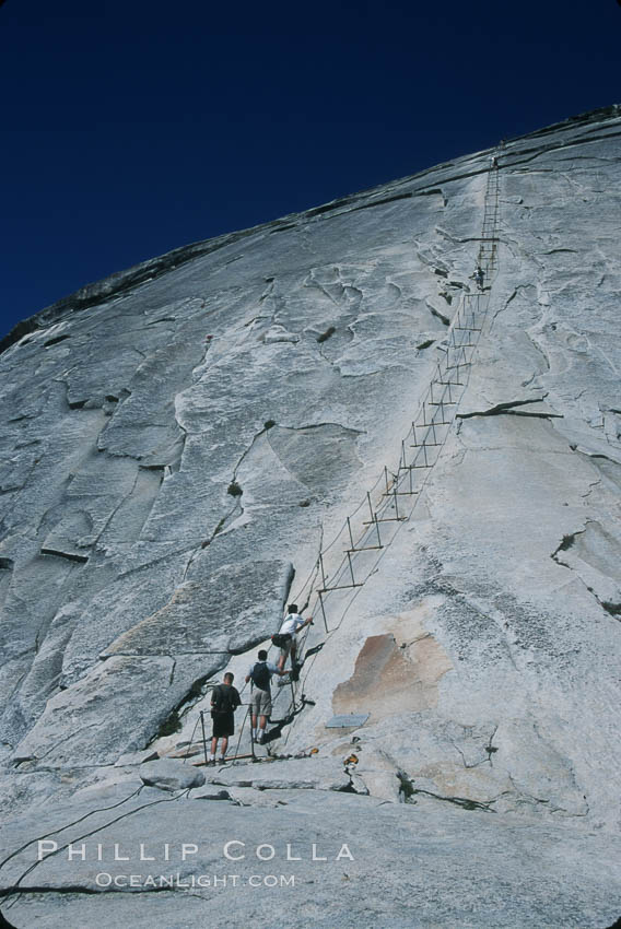 Cables guiding hikers to summit of Half Dome. Yosemite National Park, California, USA, natural history stock photograph, photo id 03462