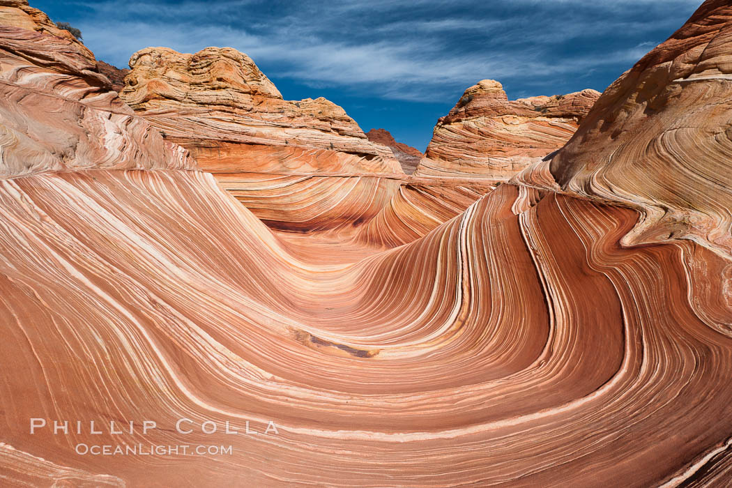 The Wave, an area of fantastic eroded sandstone featuring beautiful swirls, wild colors, countless striations, and bizarre shapes set amidst the dramatic surrounding North Coyote Buttes of Arizona and Utah.  The sandstone formations of the North Coyote Buttes, including the Wave, date from the Jurassic period. Managed by the Bureau of Land Management, the Wave is located in the Paria Canyon-Vermilion Cliffs Wilderness and is accessible on foot by permit only. USA, natural history stock photograph, photo id 20605