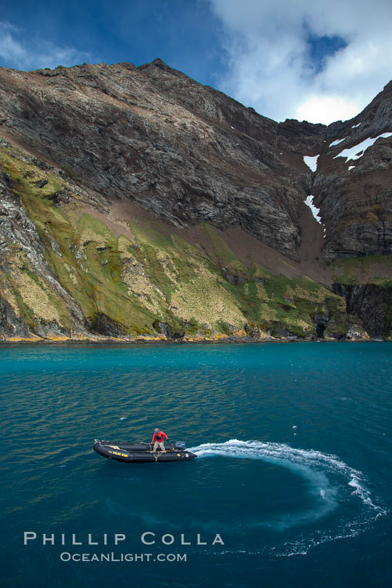 Zodiac motors through the blue-green waters of Hercules Bay. South Georgia Island, natural history stock photograph, photo id 24418