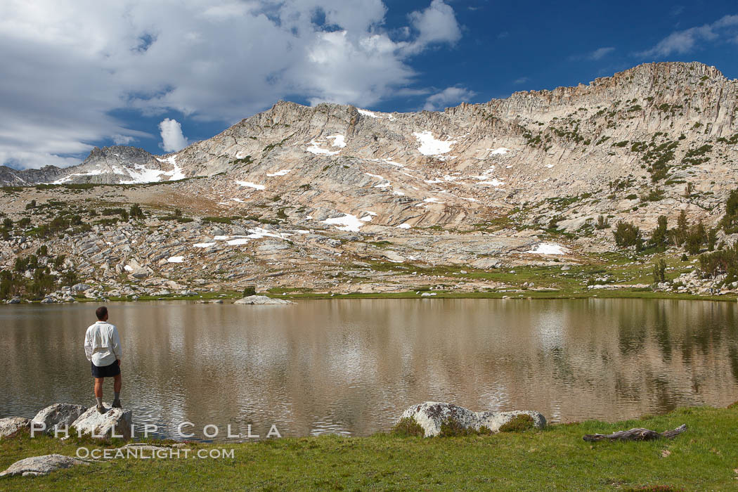 Hiker views Vogelsang Lake, and Vogelsang Peak (11516') at sunrise in Yosemite's High Sierra. Yosemite National Park, California, USA, natural history stock photograph, photo id 23201