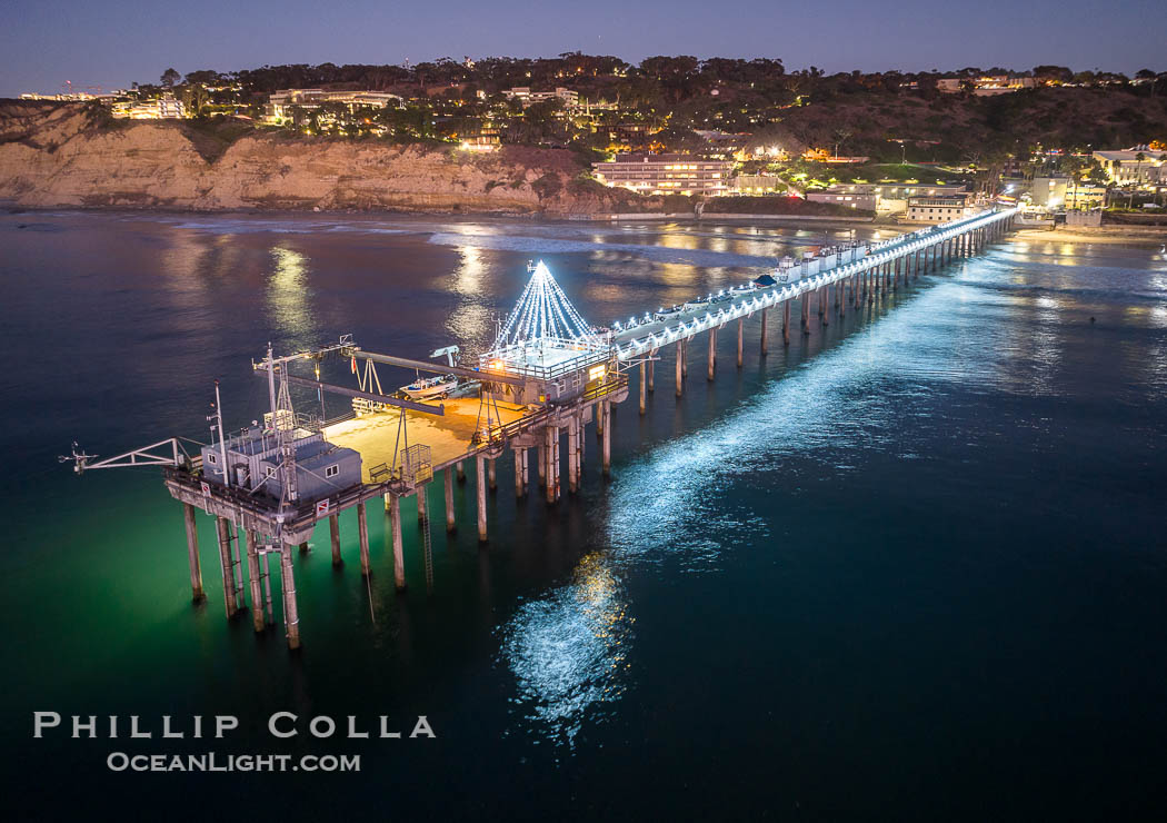 Holiday Christmas Lights on Scripps Pier, Blacks Beach and Scripps Institution of Oceanography, sunset, aerial, La Jolla, California
