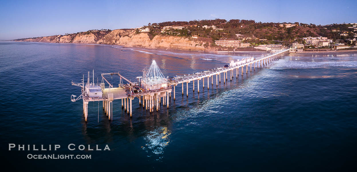 Holiday Christmas Lights on Scripps Pier, Blacks Beach and Scripps Institution of Oceanography, sunset, aerial, La Jolla, California
