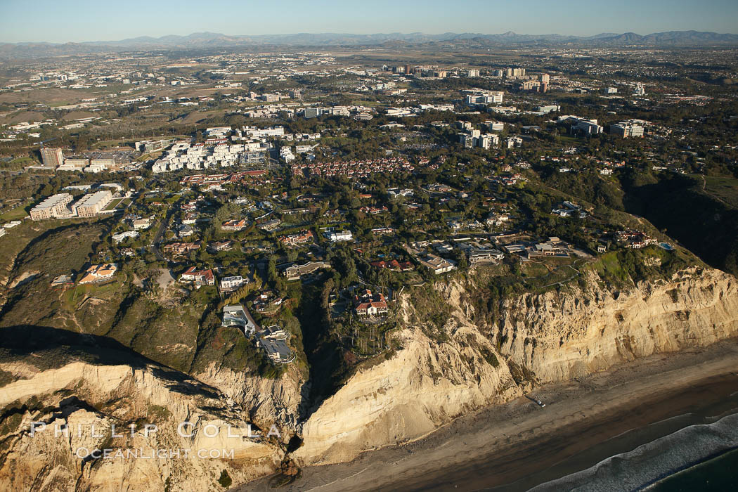 Homes in La Jolla, atop the cliffs above famous Black's Beach, with University of California San Diego in the background. USA, natural history stock photograph, photo id 22379