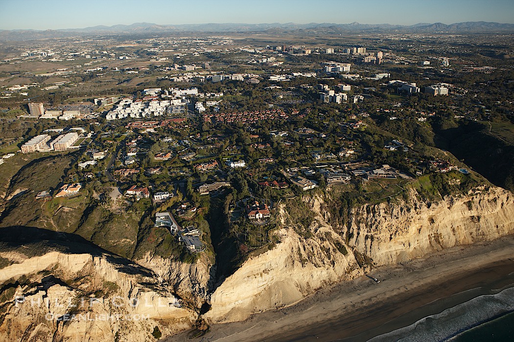 Homes in La Jolla, atop the cliffs above famous Black's Beach, with University of California San Diego in the background., natural history stock photograph, photo id 22379
