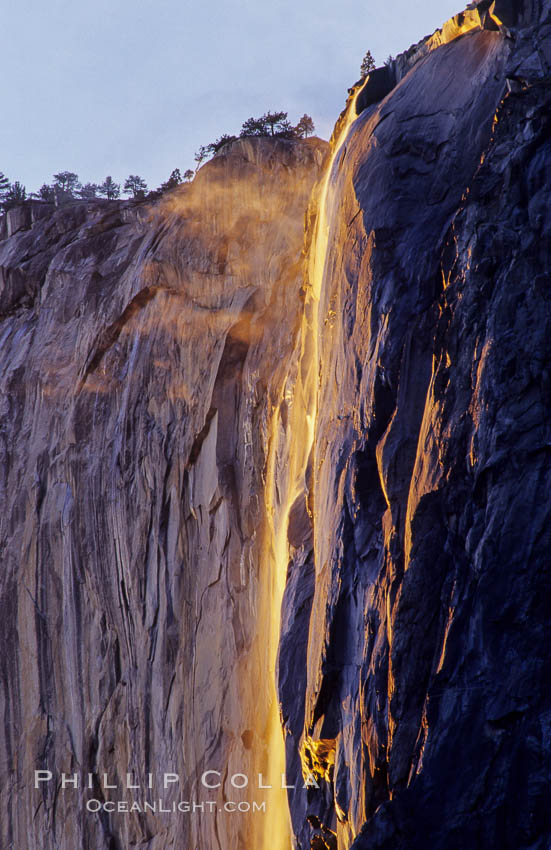 Horsetail Falls backlit by the setting sun as it cascades down the face of El Capitan, February, Yosemite Valley. Yosemite National Park, California, USA, natural history stock photograph, photo id 07048