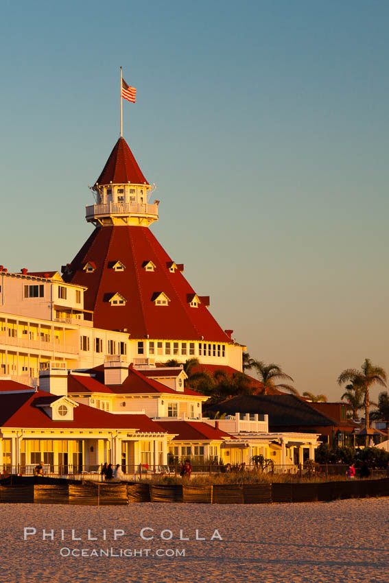 Hotel del Coronado, known affectionately as the Hotel Del. It was once the largest hotel in the world, and is one of the few remaining wooden Victorian beach resorts. It sits on the beach on Coronado Island, seen here with downtown San Diego in the distance. It is widely considered to be one of Americas most beautiful and classic hotels. Built in 1888, it was designated a National Historic Landmark in 1977. California, USA, natural history stock photograph, photo id 27394