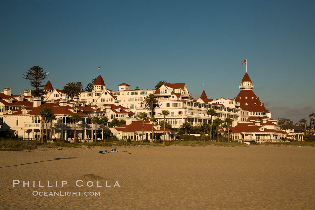 Hotel del Coronado, known affectionately as the Hotel Del. It was once the largest hotel in the world, and is one of the few remaining wooden Victorian beach resorts. It sits on the beach on Coronado Island, seen here with downtown San Diego in the distance. It is widely considered to be one of Americas most beautiful and classic hotels. Built in 1888, it was designated a National Historic Landmark in 1977., natural history stock photograph, photo id 27886
