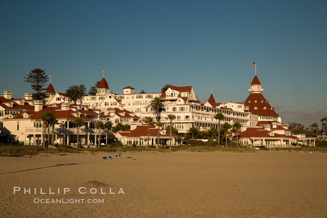 Hotel del Coronado, known affectionately as the Hotel Del. It was once the largest hotel in the world, and is one of the few remaining wooden Victorian beach resorts. It sits on the beach on Coronado Island, seen here with downtown San Diego in the distance. It is widely considered to be one of Americas most beautiful and classic hotels. Built in 1888, it was designated a National Historic Landmark in 1977. California, USA, natural history stock photograph, photo id 27886