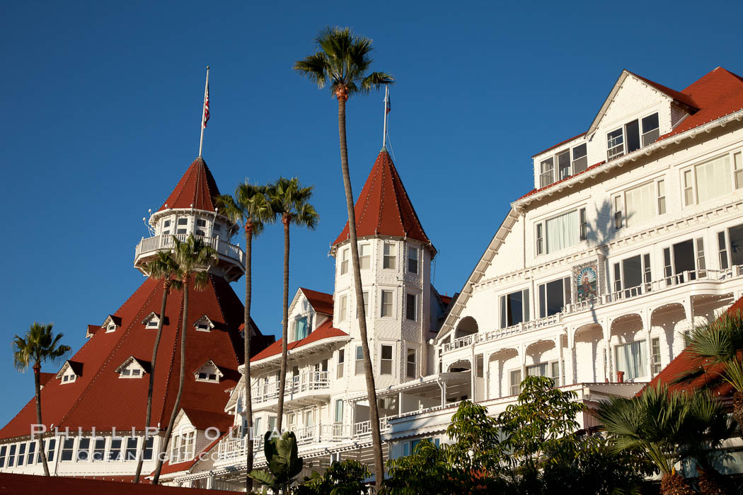Hotel del Coronado, known affectionately as the Hotel Del. It was once the largest hotel in the world, and is one of the few remaining wooden Victorian beach resorts. It sits on the beach on Coronado Island, seen here with downtown San Diego in the distance. It is widely considered to be one of Americas most beautiful and classic hotels. Built in 1888, it was designated a National Historic Landmark in 1977. California, USA, natural history stock photograph, photo id 27108