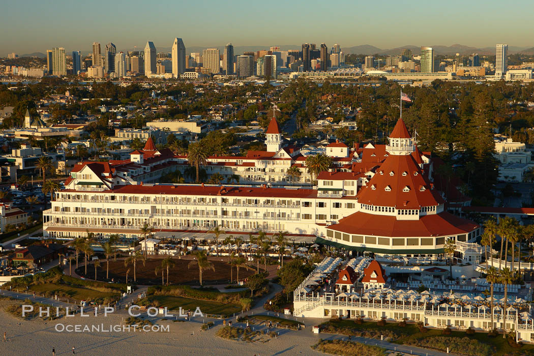 Hotel del Coronado, known affectionately as the Hotel Del.  It was once the largest hotel in the world, and is one of the few remaining wooden Victorian beach resorts.  It sits on the beach on Coronado Island, seen here with downtown San Diego in the distance.  It is widely considered to be one of Americas most beautiful and classic hotels. Built in 1888, it was designated a National Historic Landmark in 1977. California, USA, natural history stock photograph, photo id 22287