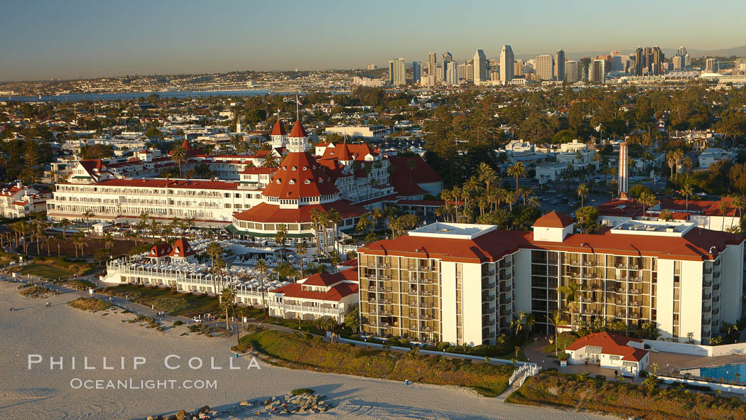 Hotel del Coronado, known affectionately as the Hotel Del.  It was once the largest hotel in the world, and is one of the few remaining wooden Victorian beach resorts.  It sits on the beach on Coronado Island, seen here with downtown San Diego in the distance.  It is widely considered to be one of Americas most beautiful and classic hotels. Built in 1888, it was designated a National Historic Landmark in 1977. California, USA, natural history stock photograph, photo id 22383