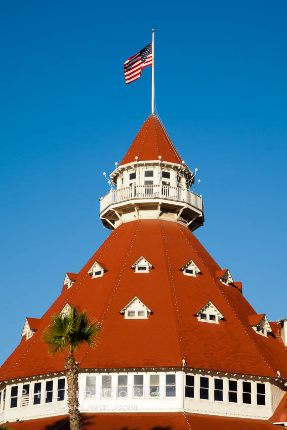 Hotel del Coronado, known affectionately as the Hotel Del. It was once the largest hotel in the world, and is one of the few remaining wooden Victorian beach resorts. It sits on the beach on Coronado Island, seen here with downtown San Diego in the distance. It is widely considered to be one of Americas most beautiful and classic hotels. Built in 1888, it was designated a National Historic Landmark in 1977. California, USA, natural history stock photograph, photo id 27107