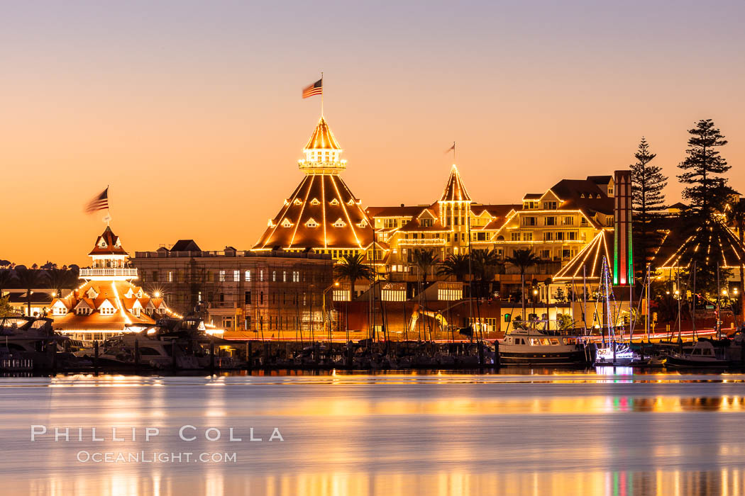 Hotel del Coronado with holiday Christmas night lights, known affectionately as the Hotel Del. It was once the largest hotel in the world, and is one of the few remaining wooden Victorian beach resorts.  The Hotel Del is widely considered to be one of Americas most beautiful and classic hotels. Built in 1888, it was designated a National Historic Landmark in 1977., natural history stock photograph, photo id 36618