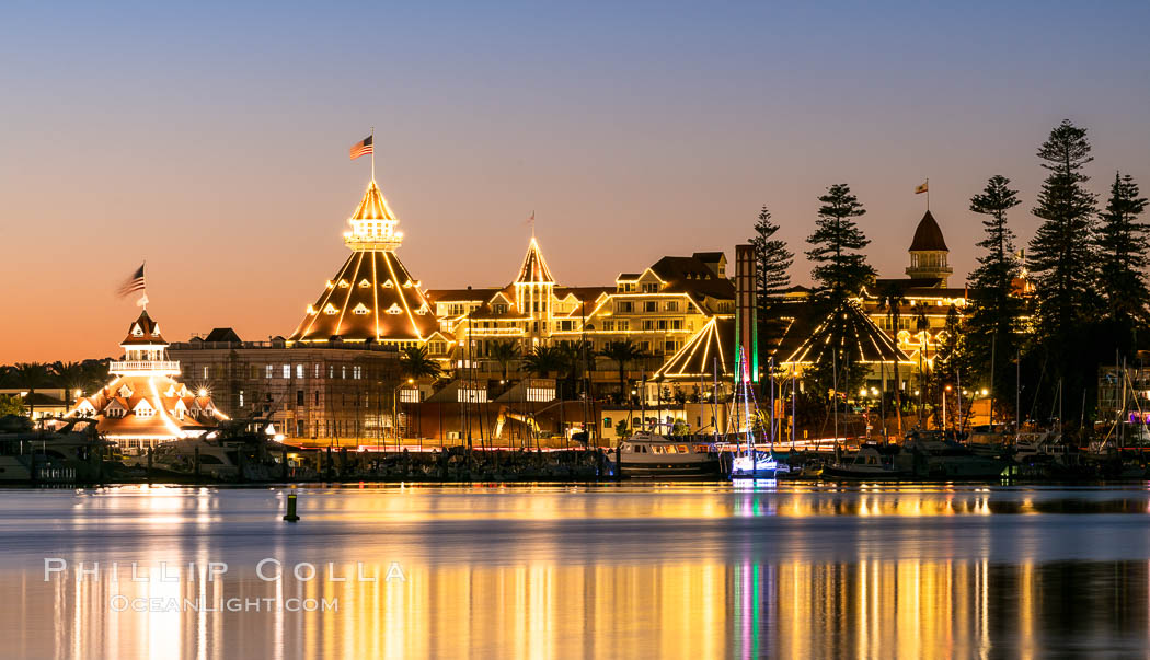 Hotel del Coronado with holiday Christmas night lights, known affectionately as the Hotel Del. It was once the largest hotel in the world, and is one of the few remaining wooden Victorian beach resorts.  The Hotel Del is widely considered to be one of Americas most beautiful and classic hotels. Built in 1888, it was designated a National Historic Landmark in 1977., natural history stock photograph, photo id 36619