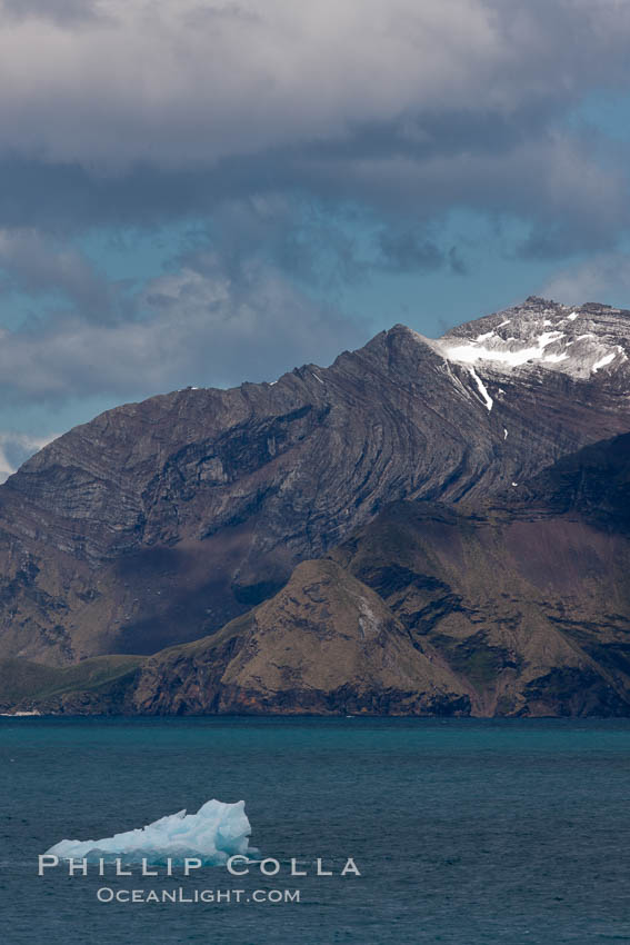 Iceberg and mountains, Cumberland Bay, near Grytviken. South Georgia Island, natural history stock photograph, photo id 24552