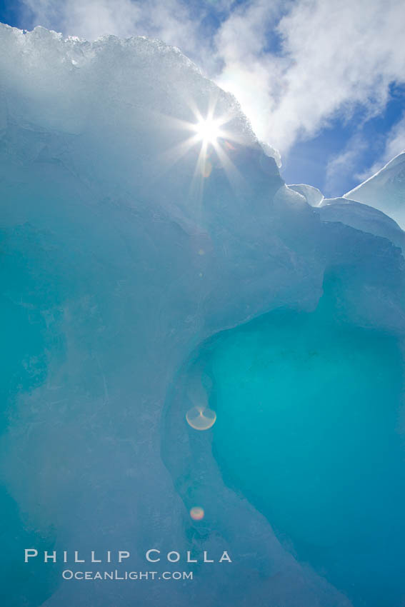 Sun peeks through a hole in ice along the shore of Paulet Island. Antarctic Peninsula, Antarctica, natural history stock photograph, photo id 24832
