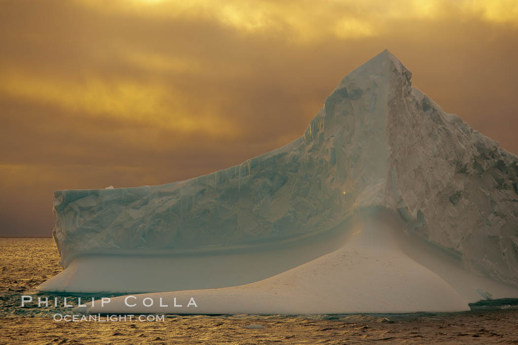Iceberg, ocean, light and clouds.  Light plays over icebergs and the ocean near Coronation Island. South Orkney Islands, Southern Ocean, natural history stock photograph, photo id 24780