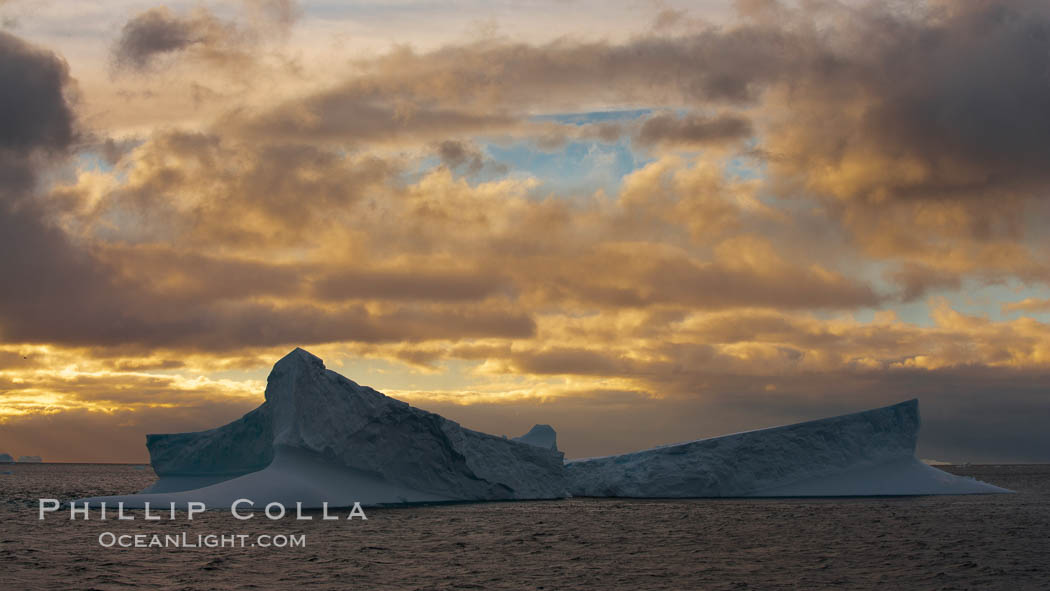 Iceberg, ocean, light and clouds.  Light plays over icebergs and the ocean near Coronation Island. South Orkney Islands, Southern Ocean, natural history stock photograph, photo id 24943