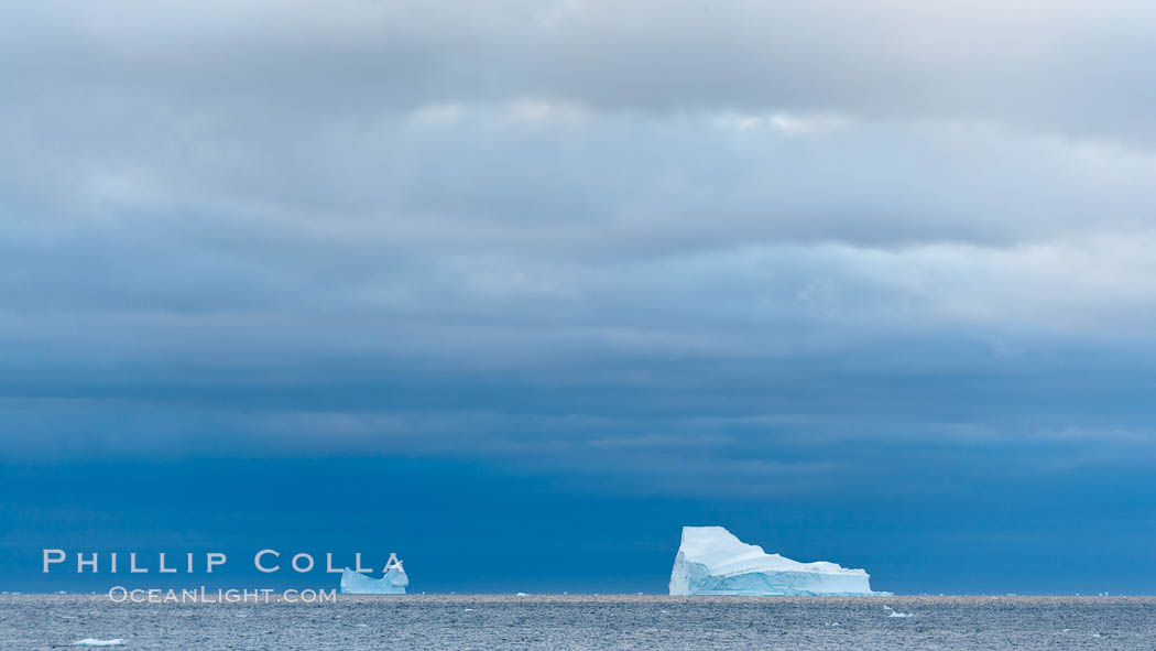 Iceberg, ocean, light and clouds.  Light plays over icebergs and the ocean near Coronation Island. South Orkney Islands, Southern Ocean, natural history stock photograph, photo id 24797