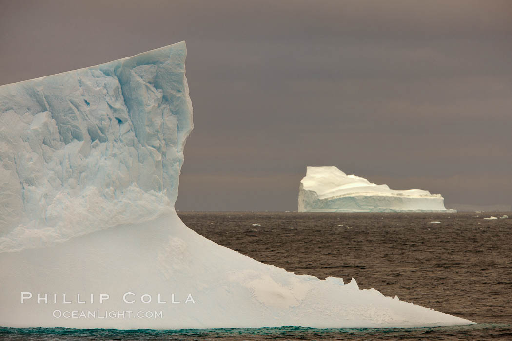 Iceberg, ocean, light and clouds.  Light plays over icebergs and the ocean near Coronation Island. South Orkney Islands, Southern Ocean, natural history stock photograph, photo id 24853