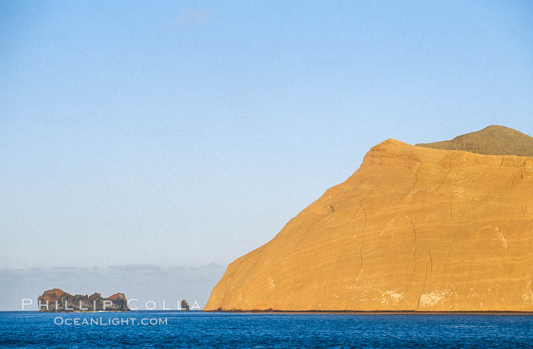 Isla Adentro (right) and Church Rock (partially obscured), sunrise. Guadalupe Island (Isla Guadalupe), Baja California, Mexico, natural history stock photograph, photo id 06138