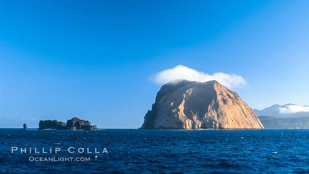 Isla Adentro (right) and Church Rock (partially obscured), sunrise. Guadalupe Island (Isla Guadalupe), Baja California, Mexico, natural history stock photograph, photo id 06141