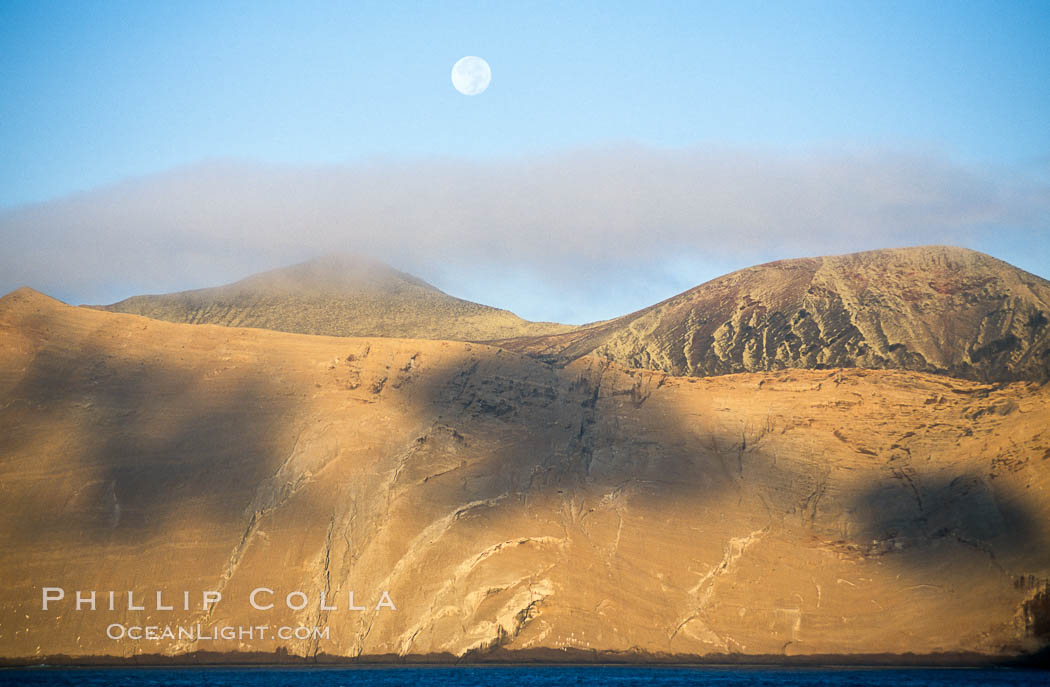 Arches on Isla Adentro and setting moon, daybreak. Guadalupe Island (Isla Guadalupe), Baja California, Mexico, natural history stock photograph, photo id 06145