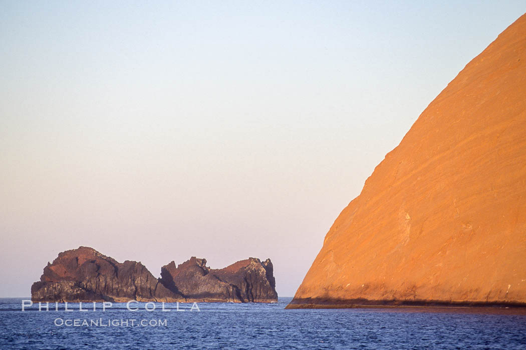 Isla Adentro (right) and Church Rock (partially obscured), sunrise. Guadalupe Island (Isla Guadalupe), Baja California, Mexico, natural history stock photograph, photo id 09757