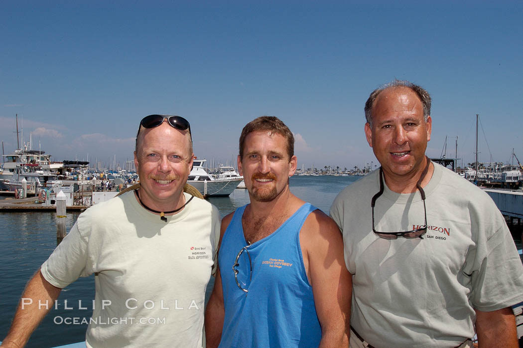 Joe Tobin (left), Doug Kuczkowski (center) and Craig OConnor (right).  In July 2004 OConnor shot a pending spearfishing world record North Pacific yellowtail (77.4 pounds), taken on a breathold dive with a band-power speargun near Battleship Point, Guadalupe Island (Isla Guadalupe), Mexico, July 2004.  Kuczkowski is the current record holder (77.0 pounds, July 1999) and Tobin is former record holder (74 pounds, July 1999). H&M Landing, San Diego, California, USA, natural history stock photograph, photo id 09747