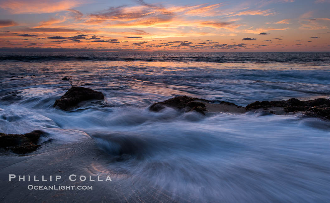 La Jolla coast sunset, waves wash over sandstone reef, clouds and sky., natural history stock photograph, photo id 27894