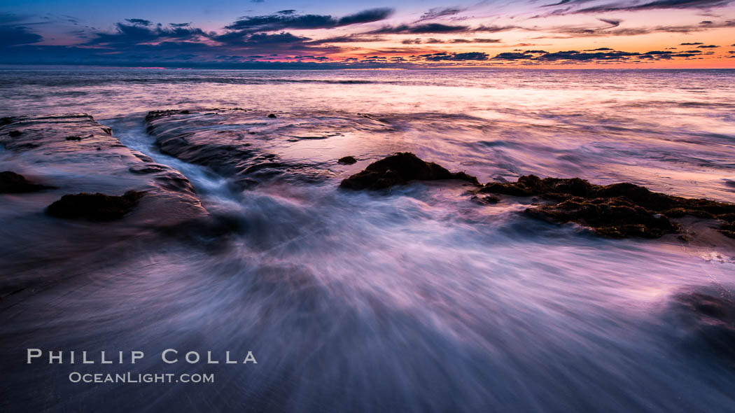 La Jolla coast sunset, waves wash over sandstone reef, clouds and sky., natural history stock photograph, photo id 27896