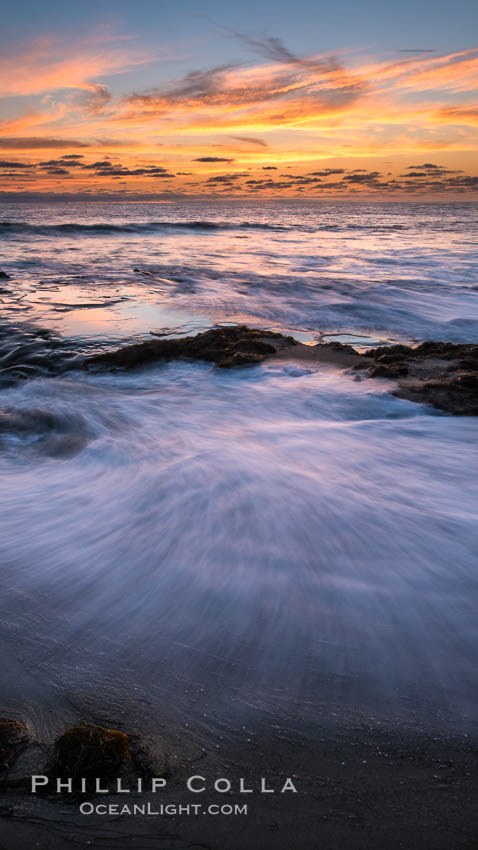 La Jolla coast sunset, waves wash over sandstone reef, clouds and sky. d 0.402760 0.496781, California, USA, natural history stock photograph, photo id 27895