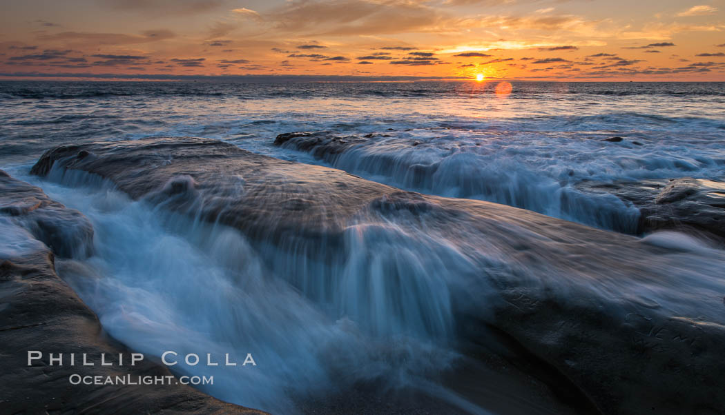 La Jolla coast sunset, waves wash over sandstone reef, clouds and sky. California, USA, natural history stock photograph, photo id 27893