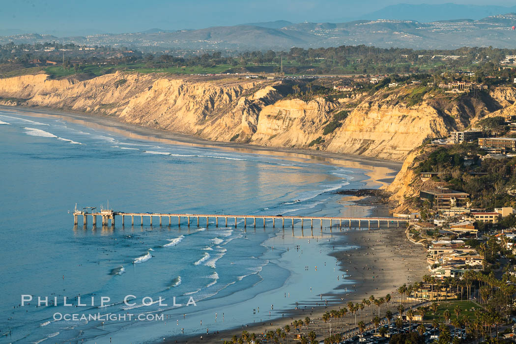 La Jolla Shores Coastline and Scripps Pier, Blacks Beach and Torrey Pines Golf Course and State Reserve, aerial photo, sunset. The Gold Coast of La Jolla basks in the warm waning light of a winter afternoon