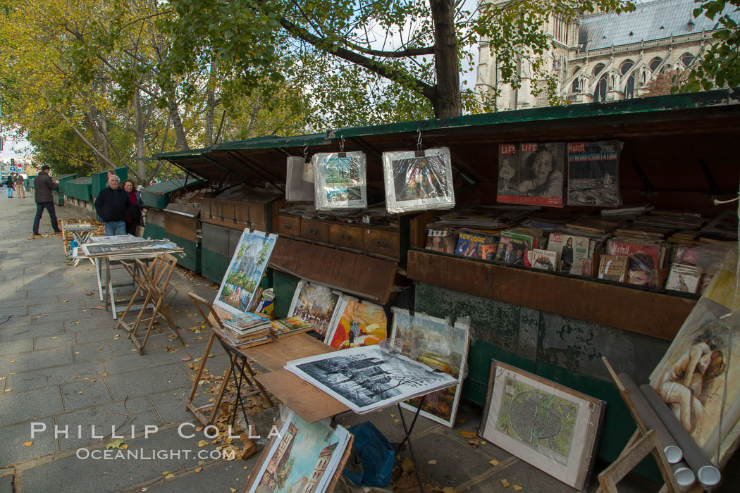 Art Seller along La Rive Gauche, the Left Bank, Paris. La Rive Gauch, the Left Bank, is the southern bank of the river Seine in Paris. Here the river flows roughly westward, cutting the city in two: looking downstream, the southern bank is to the left, and the northern bank (or Rive Droite) is to the right. France, natural history stock photograph, photo id 28146