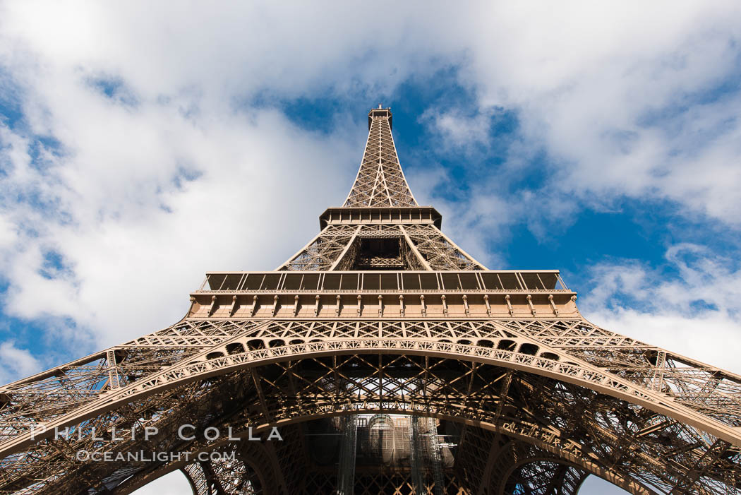 La Tour Eiffel. The Eiffel Tower is an iron lattice tower located on the Champ de Mars in Paris, named after the engineer Gustave Eiffel, who designed the tower in 1889 as the entrance arch to the 1889 World's Fair. The Eiffel tower is the tallest structure in Paris and the most-visited paid monument in the world. France, natural history stock photograph, photo id 28114