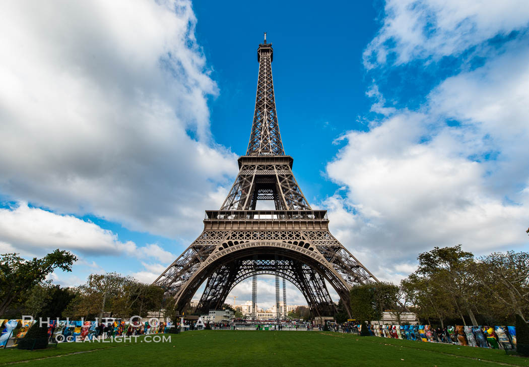 La Tour Eiffel. The Eiffel Tower is an iron lattice tower located on the Champ de Mars in Paris, named after the engineer Gustave Eiffel, who designed the tower in 1889 as the entrance arch to the 1889 World's Fair. The Eiffel tower is the tallest structure in Paris and the most-visited paid monument in the world. France, natural history stock photograph, photo id 28112