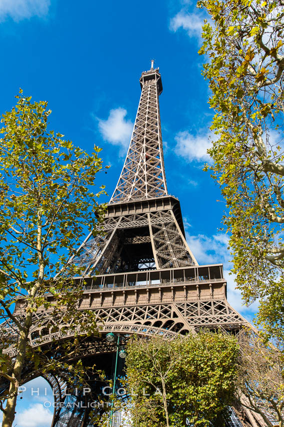 La Tour Eiffel. The Eiffel Tower is an iron lattice tower located on the Champ de Mars in Paris, named after the engineer Gustave Eiffel, who designed the tower in 1889 as the entrance arch to the 1889 World's Fair. The Eiffel tower is the tallest structure in Paris and the most-visited paid monument in the world. France, natural history stock photograph, photo id 28116