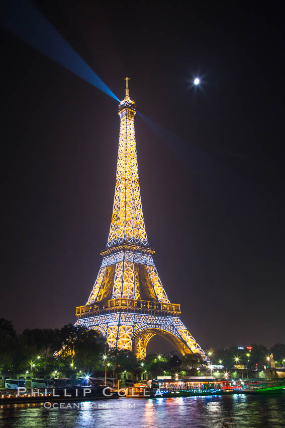 River Seine, Full Moon and Eiffel Tower at night, Paris. La Tour Eiffel. The Eiffel Tower is an iron lattice tower located on the Champ de Mars in Paris, named after the engineer Gustave Eiffel, who designed the tower in 1889 as the entrance arch to the 1889 World's Fair. The Eiffel tower is the tallest structure in Paris and the most-visited paid monument in the world. France, natural history stock photograph, photo id 28203