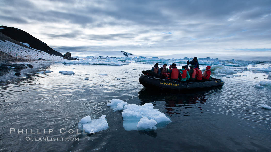 Landing ashore at Paulet Island, in an inflatable, at sunset. Antarctic Peninsula, Antarctica, natural history stock photograph, photo id 24826