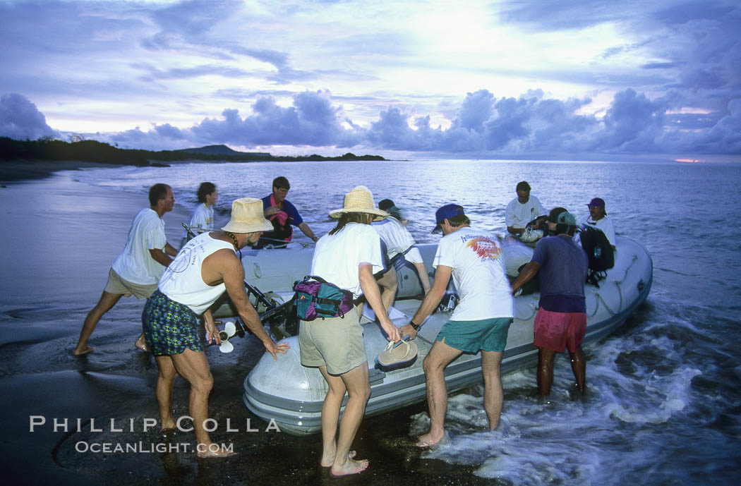 Land visit and sunset, skiff and tourists. Floreana Island, Galapagos Islands, Ecuador, natural history stock photograph, photo id 03474