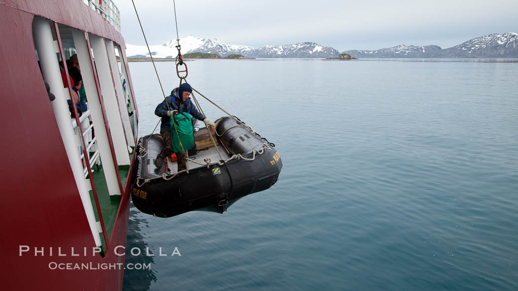 Launching a zodiac inflatable skiff boat, from the icebreaker M/V Polar Star. Salisbury Plain, South Georgia Island, natural history stock photograph, photo id 24460