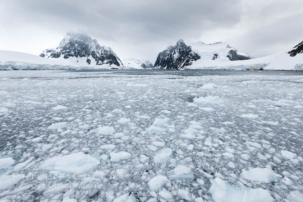 Lemaire Channel: mountains, sea, ice and clouds, Antarctica.  The Lemaire Channel, one of the most scenic places on the Antarctic Peninsula, is a straight 11 km long and only 1.6 km wide at its narrowest point., natural history stock photograph, photo id 25622