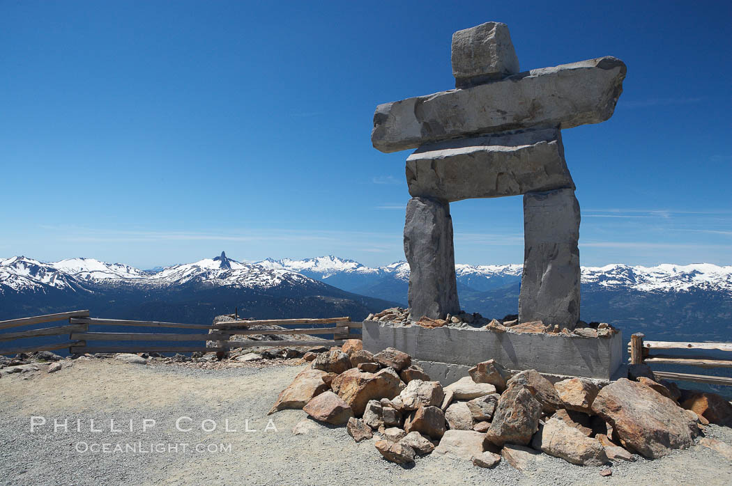 Ilanaaq, the logo of the 2010 Winter Olympics in Vancouver, is formed of stone in the Inukshuk-style of traditional Inuit sculpture.  This one is located on the summit of Whistler Mountain. British Columbia, Canada, natural history stock photograph, photo id 21014